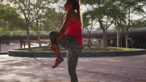 Caucasian-woman-stretching-under-a-bridge