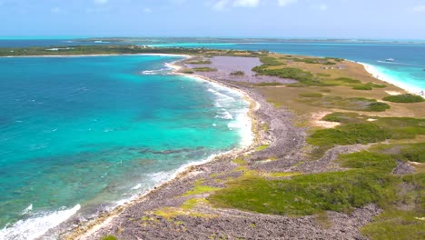 Aerial-View-people-Kiteboarding-Extreme-Sport-on-caribbean-island-Los-Roques,-turn-left