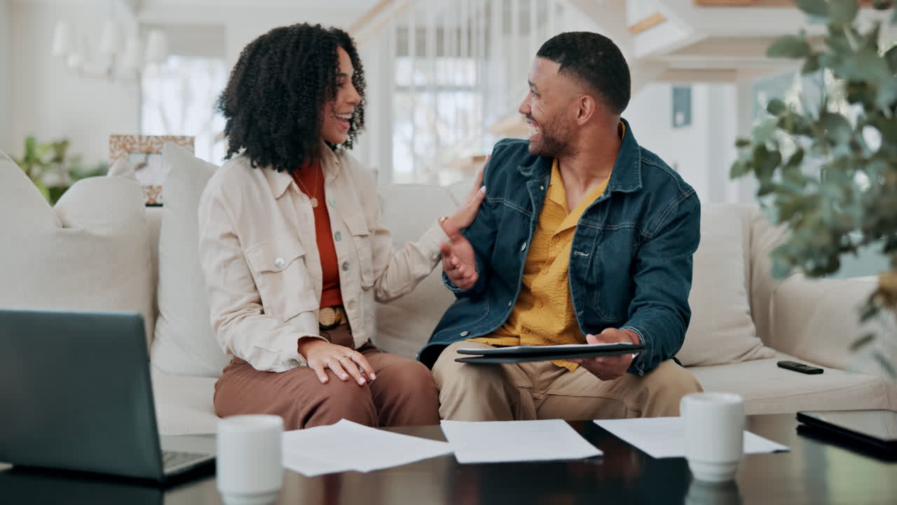 Couple celebrating success at home