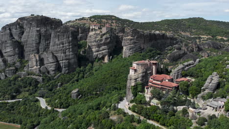 Orbit-Aerial-view-Holy-Monastery-of-Rousanos---Saint-Barbara-Meteora-rock-formation-Greece-sunny-day