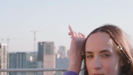 Close-up-view-of-young-woman-on-a-terrace