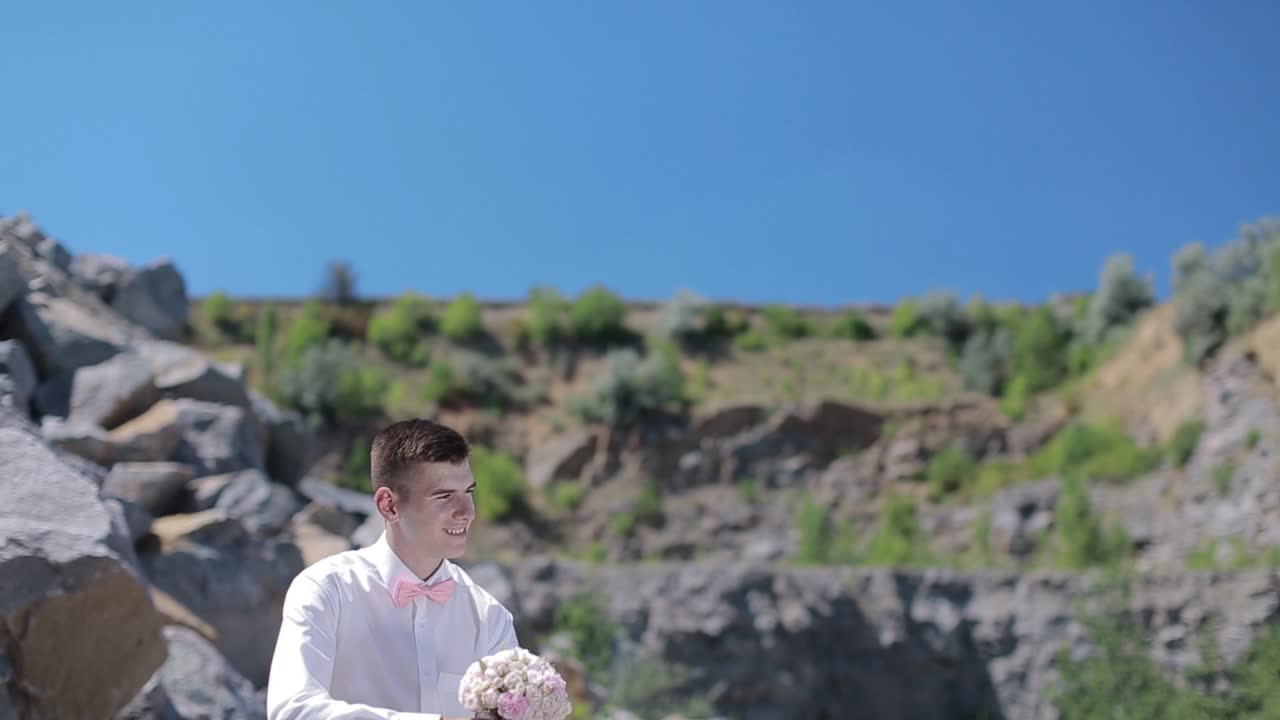 Young Wedding Couple Outdoor. Charming bride and elegant groom on landscapes of mountains