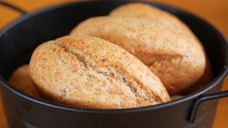 freshly baked bread rolls in a rustic basket