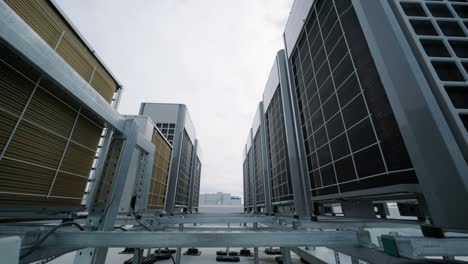 the air conditioning and ventilation system of a large industrial facility is located on the roof. it includes an air conditioner, smoke exhaust, and ventilation.