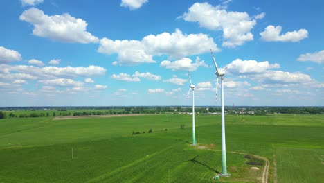 aerial view of powerful wind turbine farm for energy production on beautiful cloudy sky at highland