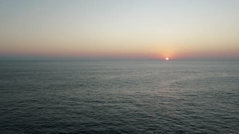 Scenic-Sunset-And-Tranquil-Ocean-At-Puerto-Escondido,-Oaxaca,-Mexico---aerial-drone-shot