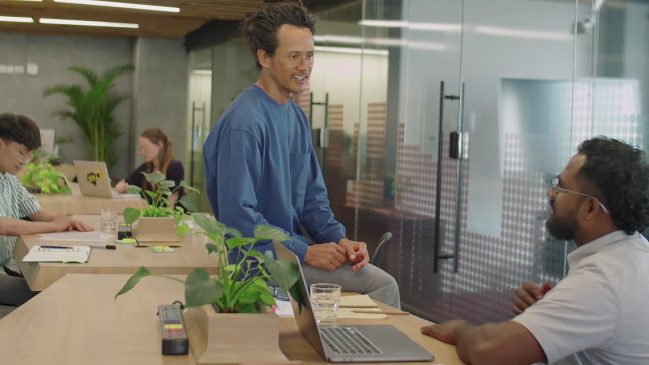Male Friends Chatting in Coworking Room