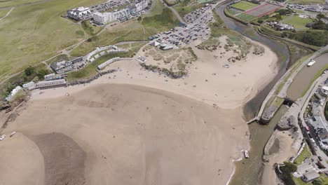 aerial view of a coastal town and beach with river estuary
