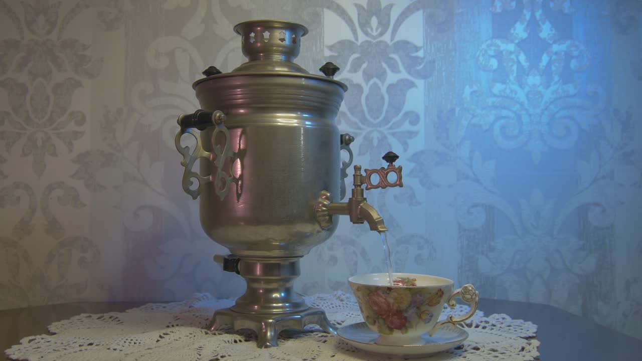 Pouring Hot Water From a Vintage Samovar Metal Tea Kettle into a Gorgeous Cup. Video Dolly Arc Right