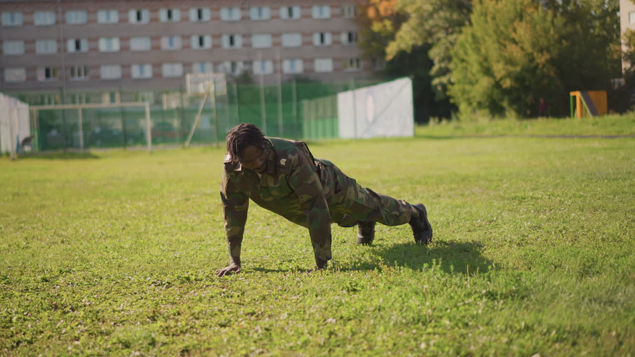 Military Fitness Routine, Soldier Trains In Endurance With Burpees And Pushups Outside, Military Personnel Engage In Rigorous Physical Activity In Natural Setting For Endurance Improvement