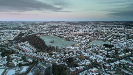 cold winter cinematic aerial view of a delicate pink and blue early morning sunrise sky