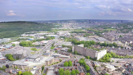 aerial flyover of a typical busy rural english town with traffic and houses