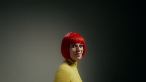 woman with red hair and yellow sweater