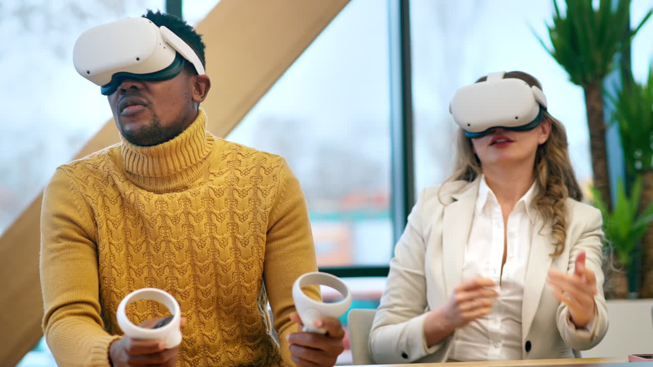 Business conference in VR in an office. Multiracial group of people talking and using VR glasses and controllers