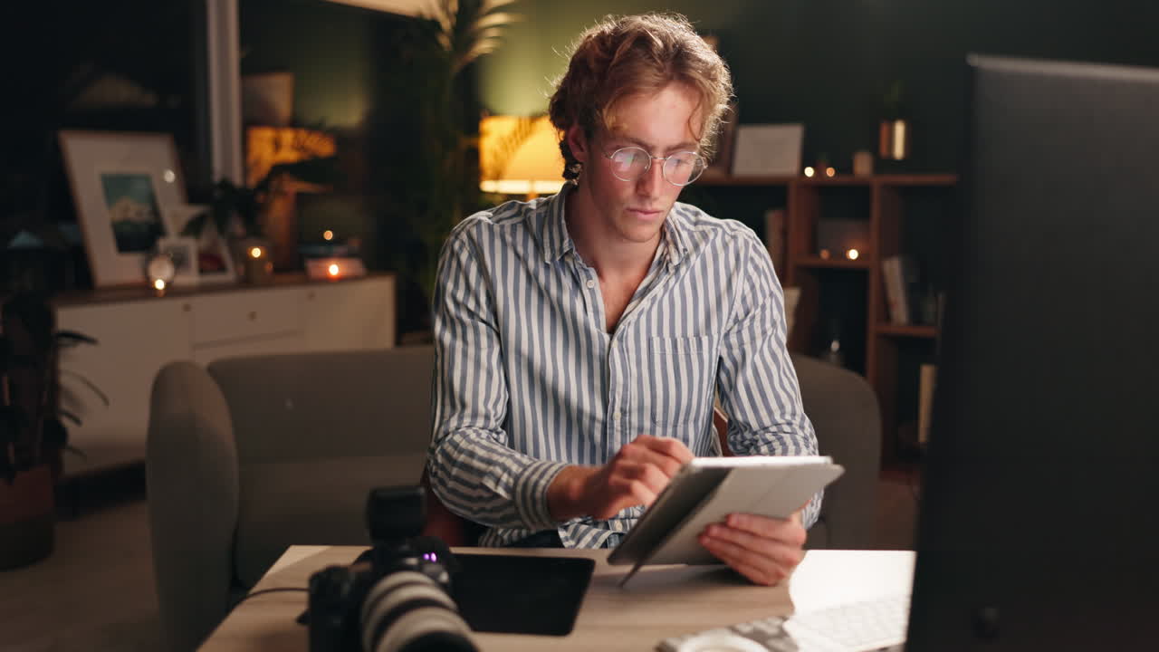 Man working on tablet at home