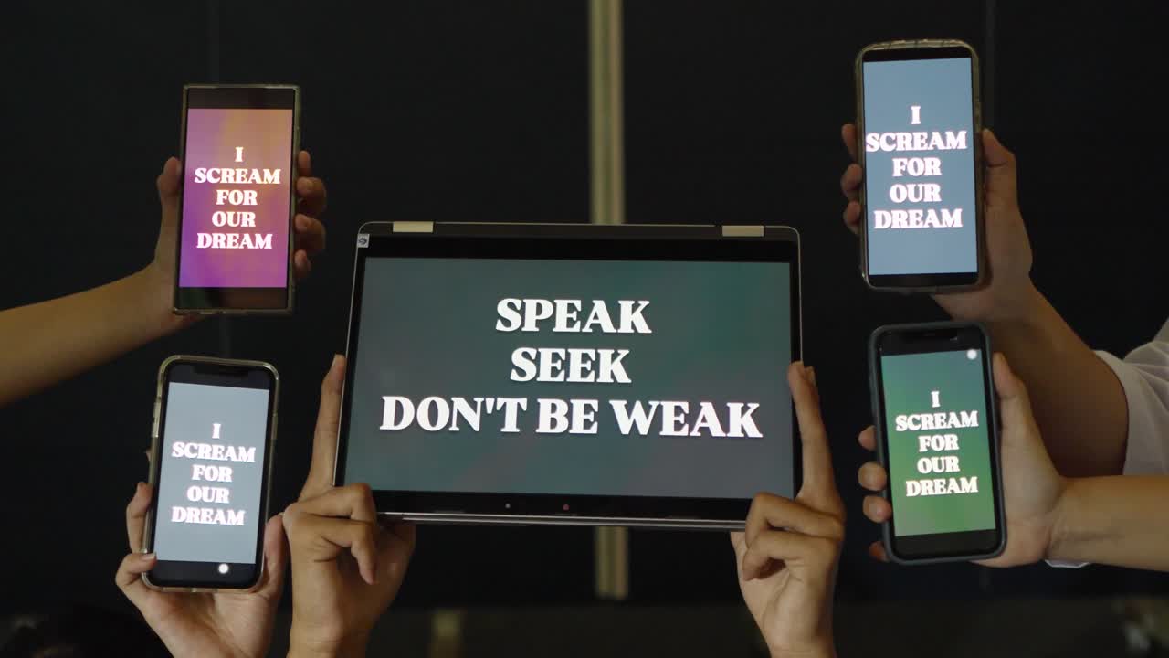 Fixed camera captures students holding phones and tablet with motivational text during school activity in Jakarta, Indonesia
