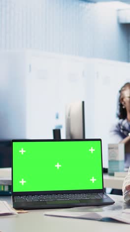 laptop with green screen in medical office