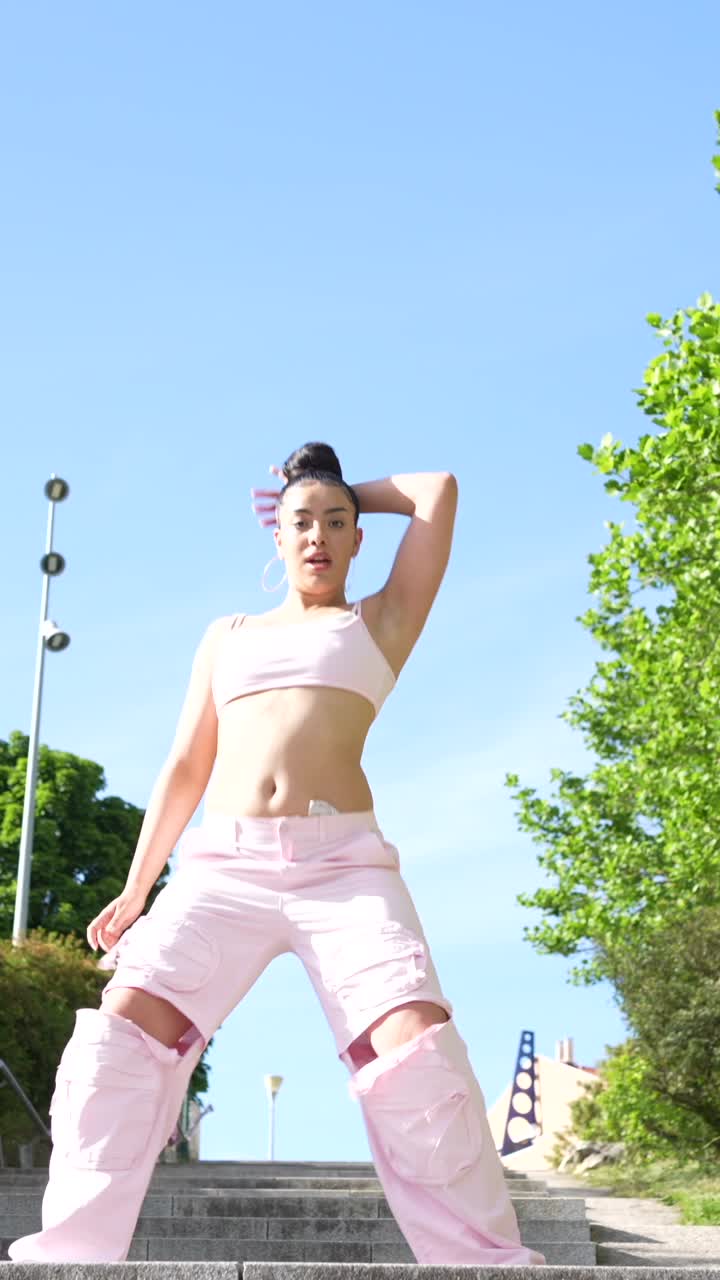 Young Woman in Fashionable Outfit Dancing on Steps