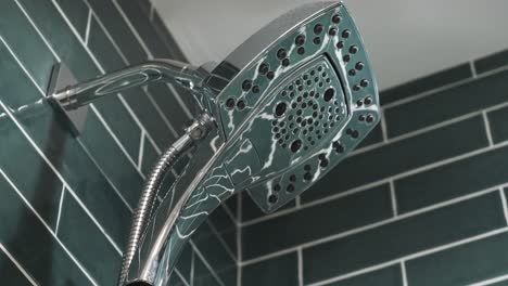 Newly-installed-shower-head-in-remodeled-bathroom,-modern-luxury-style