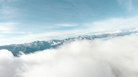 Aerial-drone-flight-above-clouds-with-FPV-drone-in-Switzerland-on-sunny-summer-day-with-spectacular-panorama