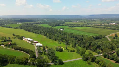 aerial drone view of farmland on sunny day