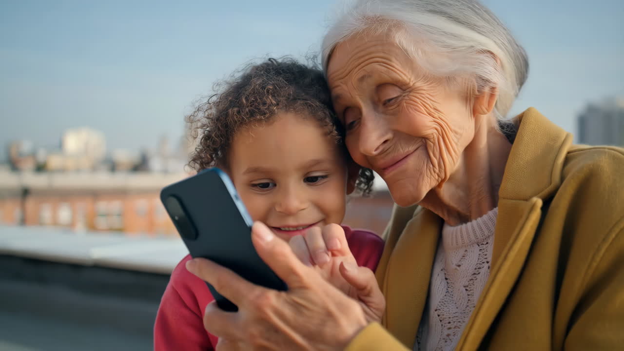 Grandmother and Granddaughter Sharing a Moment with a Phone