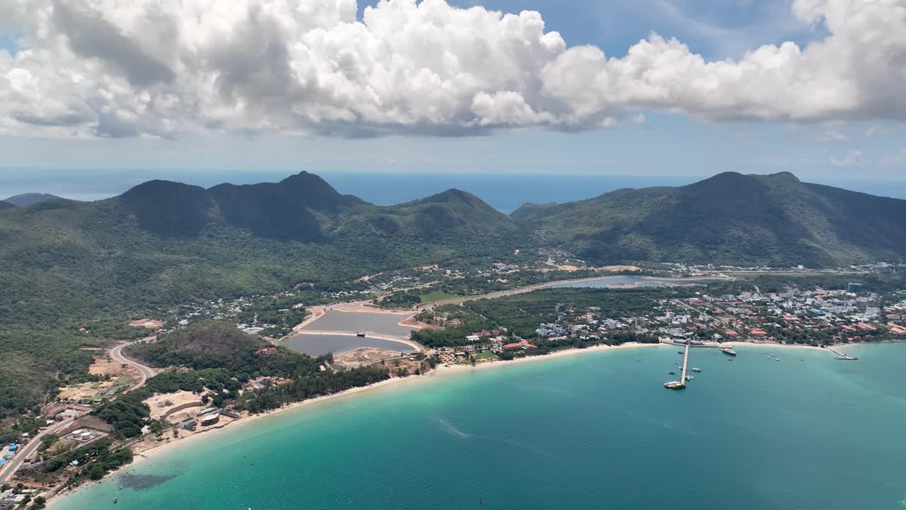 Con Dao Island, Vietnam - A Scenic View of a Coastal Town Framed by Mountains in the Background - Aerial Drone Shot