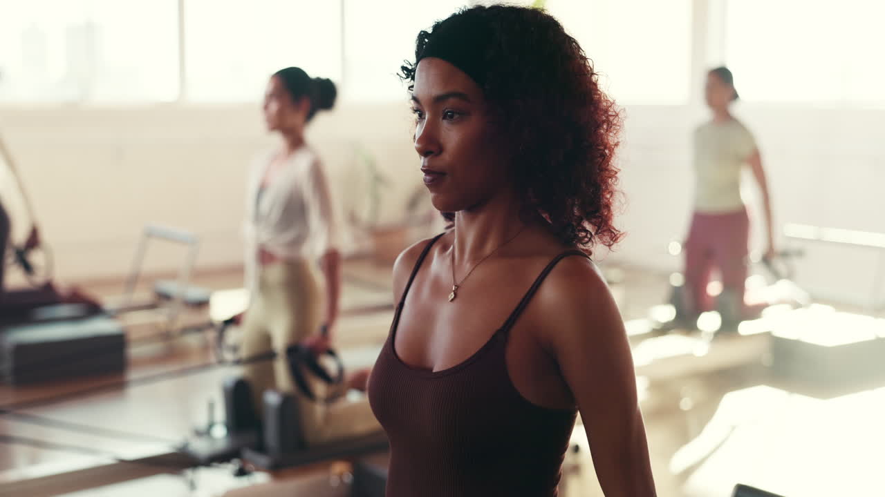 Women doing pilates exercise in a studio