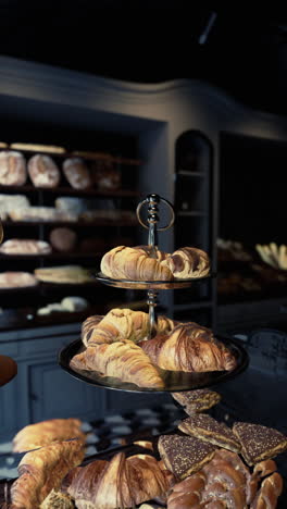 a bakery display with fresh baked croissants and other pastries.