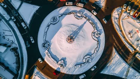 4k aerial view timelapse of roundabout road with circular cars in small european city at sunny winter day, steady shot