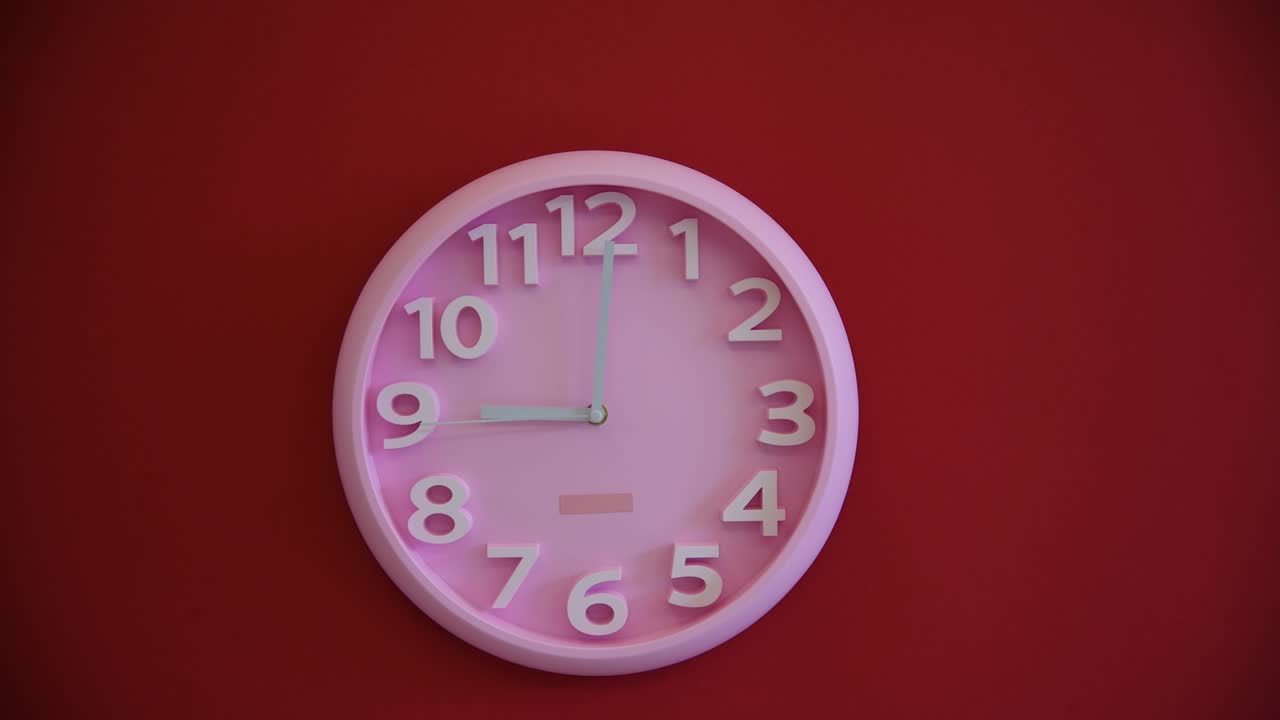 Pink wall clock on red background