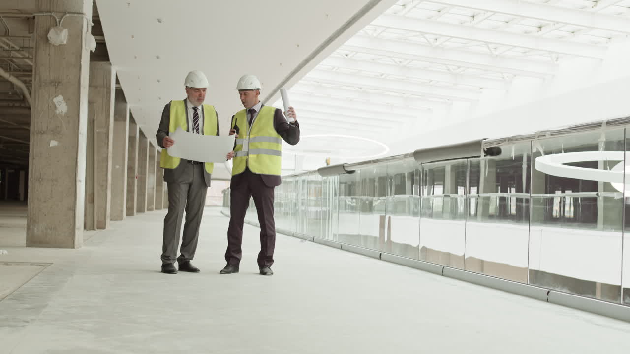 Men Talking in Mall Under Construction
