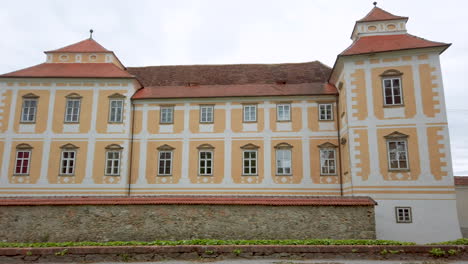 renaissance baroque palace in medieval european town, castle in slovenska bistrica, slovenia, panning shot of northern facade