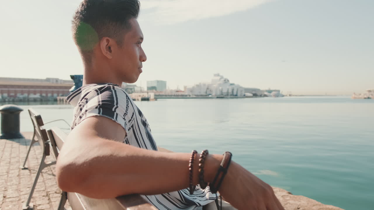 Man Relaxing by the Waterfront