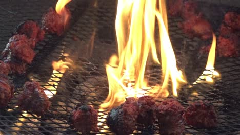 Slow-motion-fire-and-sausages-on-a-grill