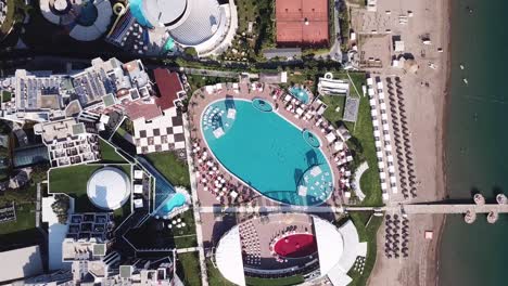 aerial view of a luxurious resort complex with beach and pool