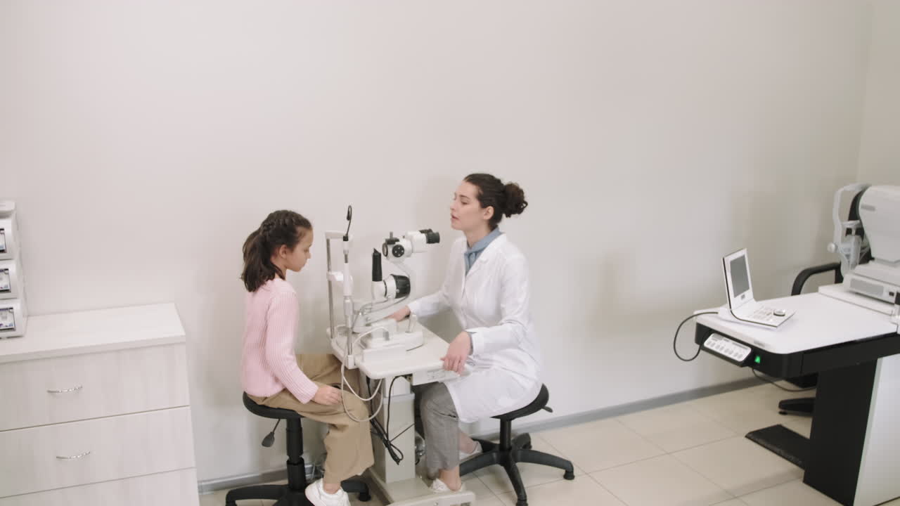 Little Girl At Optometrist Appointment For Eye Checkup