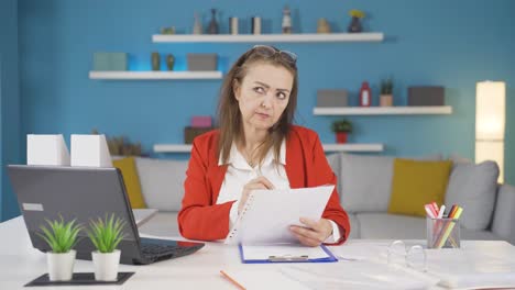 home office worker woman examining, analyzing documents.