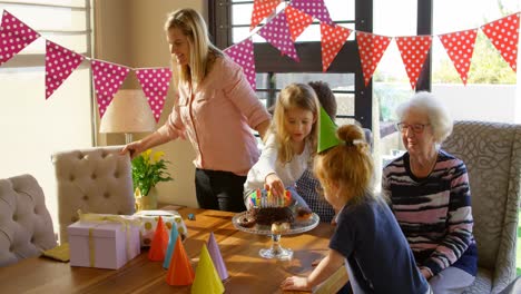 multi-generation family celebrating birthday in living room at home 4k