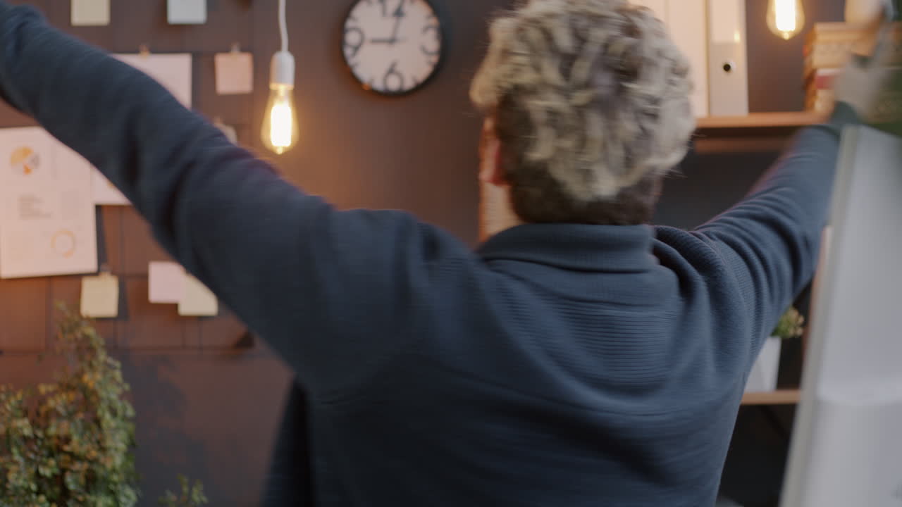 Happy employee celebrating success in office