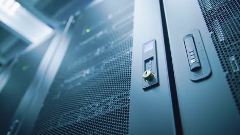 a close-up view of high-tech server hardware: modern data center infrastructure featuring lock mechanisms and digital controls for secure data management