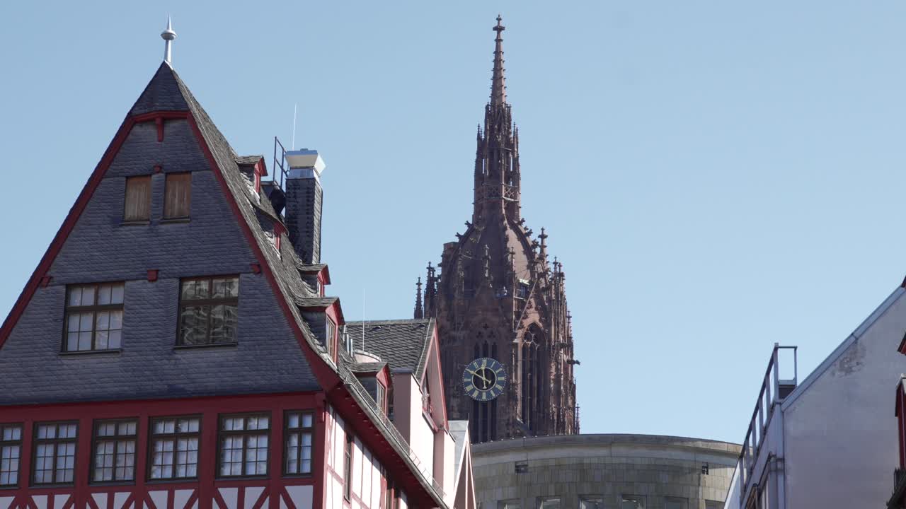 Gothic Cathedral Spire and Half-Timbered Houses in Germany