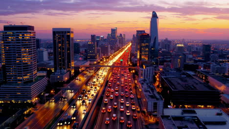 aerial view of a busy city highway at sunset