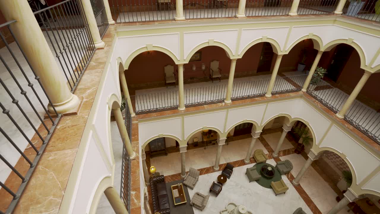Beautiful Andalucian architecture in Sevilla, Spain, courtyard filmed in 4k with gimbal moving forwards and tilting down