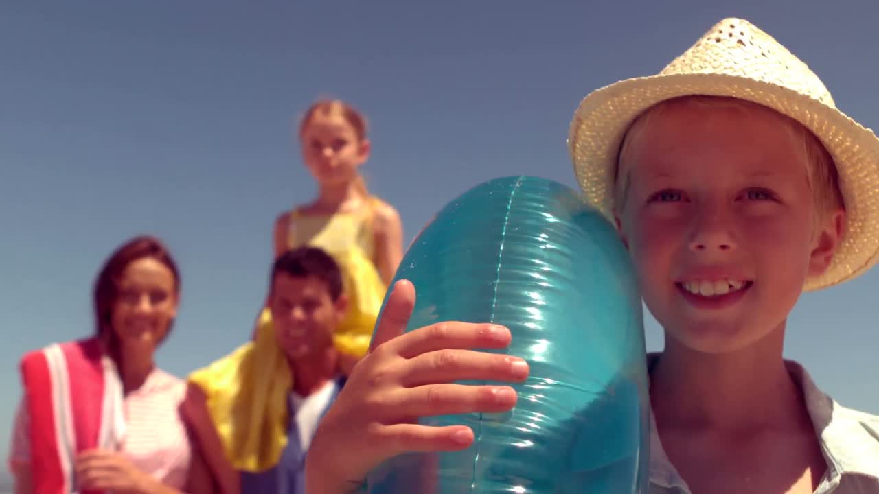Happy family posing with buoys