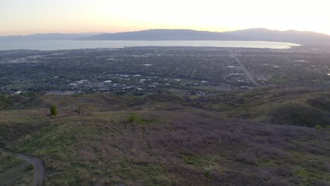 Friends-enjoy-sunset-around-campfire-drone-dolly-forward-to-reveal-provo