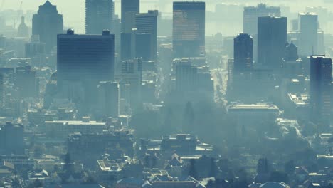 General-view-of-cityscape-with-multiple-modern-buildings-covered-in-smog