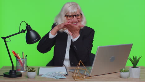 senior rich businesswoman showing wasting or throwing money around hand gesture, more tips, cashback
