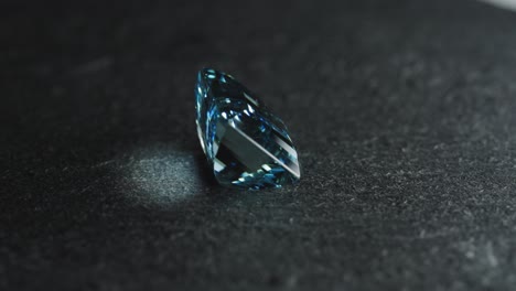 polished blue gemstone rotates and sparkles