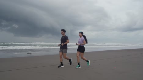 couple running on a beach